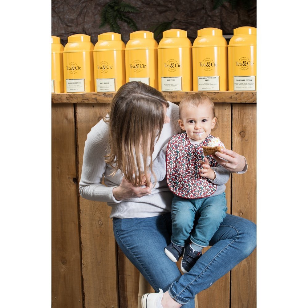 Coated fabric bib prairie fleurie