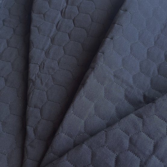 Quilted fabric black hexagonal quilt
