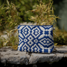 Cosmetic bag with flap jacquard bleu
