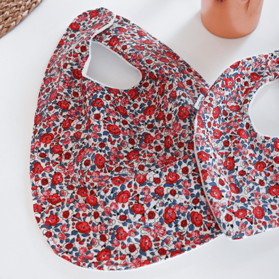 Coated fabric bib rouge corolle