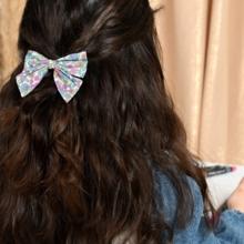 Bow tie hair slide pastel fleuri