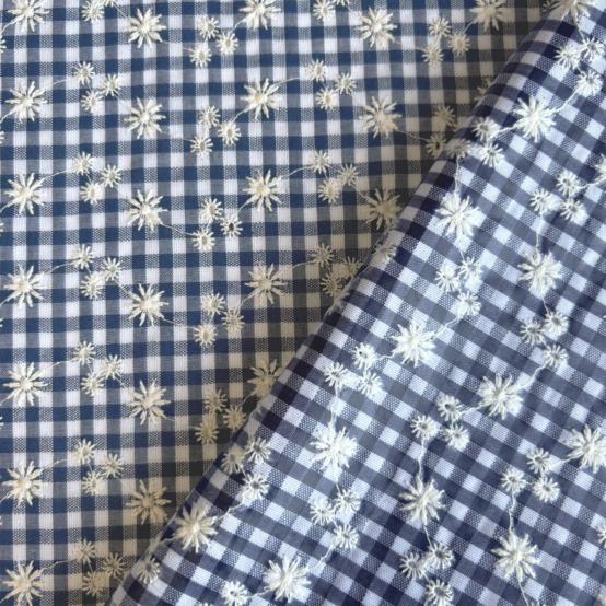 Coated fabric navy embroidered gingham