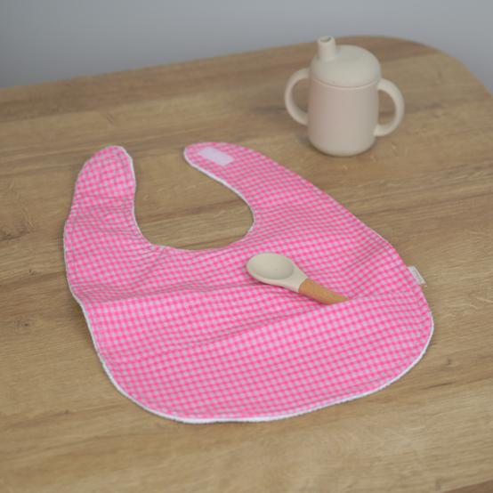 Coated fabric bib neon pink gingham