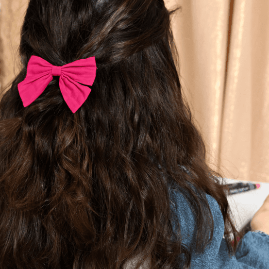 Bow tie hair slide fuschia