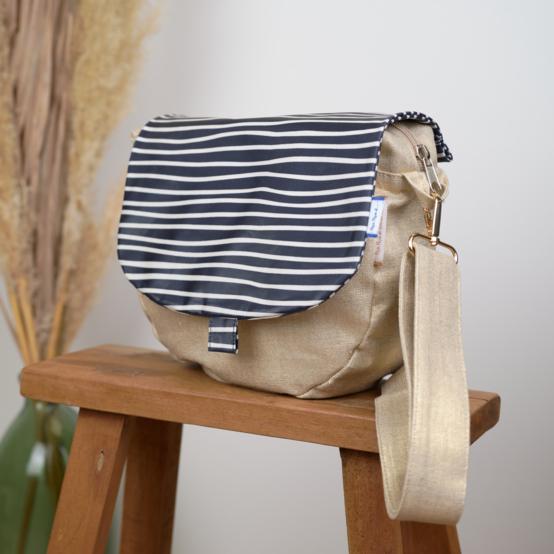Flap of small shoulder bag striped  ivory navy