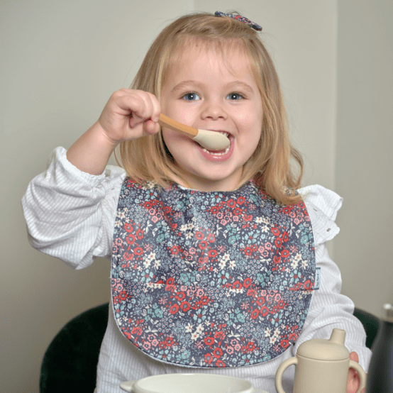 Coated fabric bib jardin d'aurore