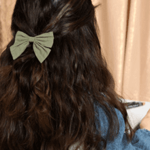 Bow tie hair slide almond green with golden dots gauze