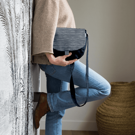 Flap of small shoulder bag striped silver dark blue