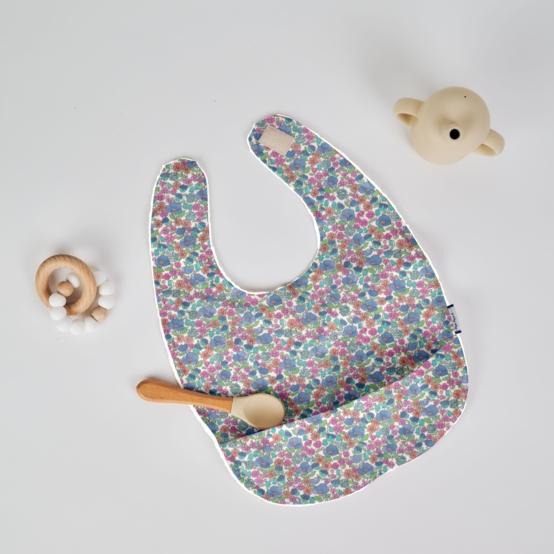 Coated fabric bib pastel fleuri