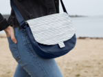 Flap of small shoulder bag striped blue gray glitter