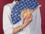 Hand-held fan soleil levant