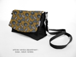 Flap of shoulder bag hen facet