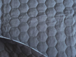Quilted fabric black hexagonal quilt