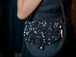 Flap of small shoulder bag purple black sequin