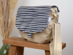 Flap of small shoulder bag striped  ivory navy