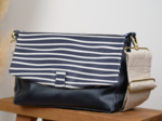 Flap of shoulder bag striped  ivory navy