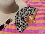 Hand-held fan attrape soleil