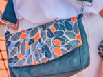 Flap of shoulder bag kumquat party