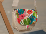 Flap of small shoulder bag fleurs des iles