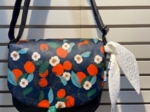 Flap of small shoulder bag mandarina