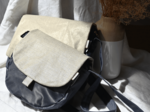 Flap of small shoulder bag golden linen