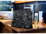 Cosmetic bag with flap fireflies