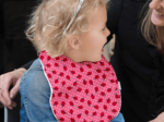 Coated fabric bib ladybird gingham