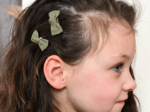 Small bows hair clips almond green with golden dots gauze