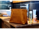Cosmetic bag with flap caramel golden straw