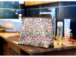 Cosmetic bag with flap spring