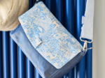 Flap of shoulder bag toile de biche