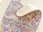 Coated fabric bib comptine enchantée rose